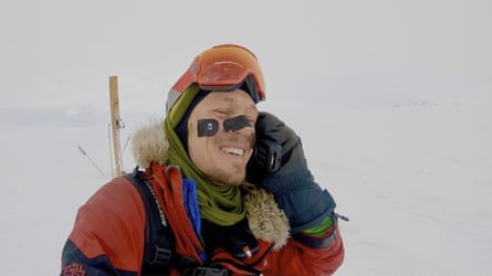 Colin O’Brady speaks on the phone in Antarctica.