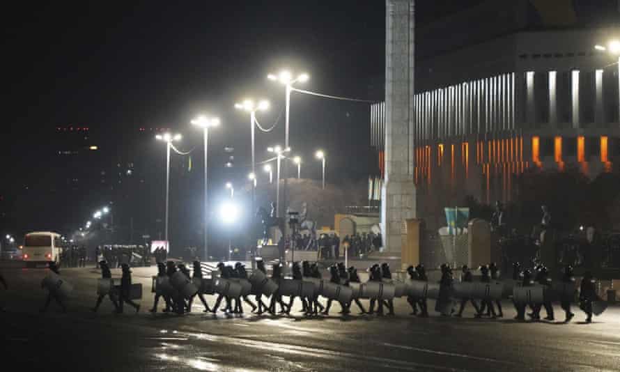 A line of riot police in the center of Almaty