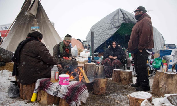 As snow began to fall, activists said that they wanted people to remain at the camp and called for more to arrive.