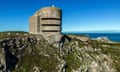 A tall concrete structure on the Alderney coast