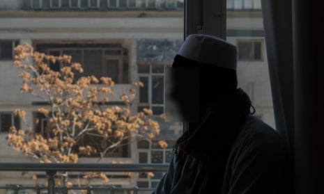 Silhouette of Afghan boy  against a window.