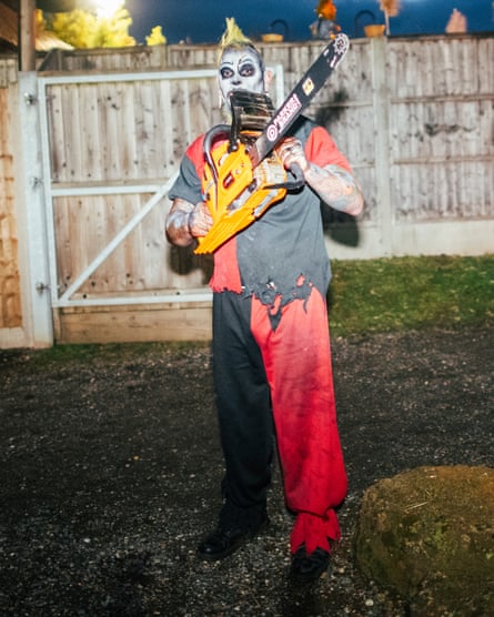 Neville Everett in a scary face mask wields his chainsaw.