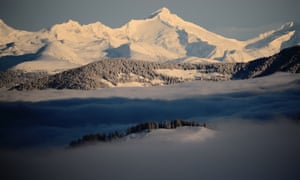 Fog partially covers the Dolomite mountains