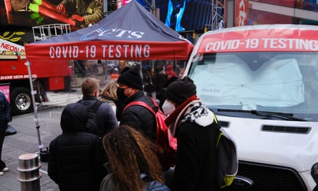 People wait in line to get tested for Covid-19 in Times Square, New York.