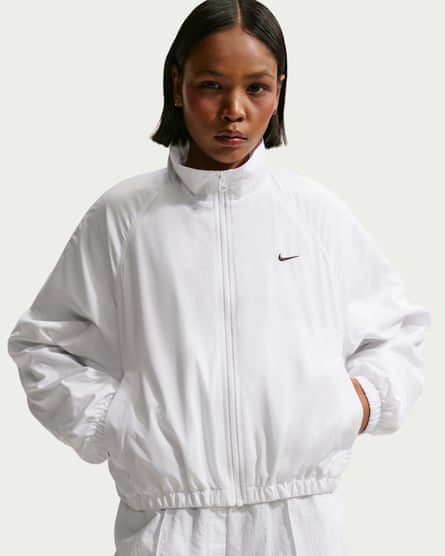 woman wearing white windbreaker and matching pants