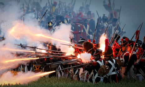 Soldiers fire muskets during a re-enactment of the Battle of Waterloo