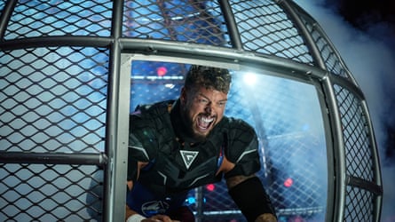 Gladiator Giant looking out of a cage