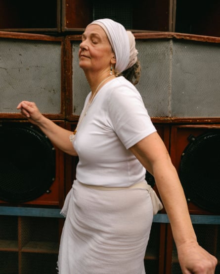 A woman closing her eyes and dancing
