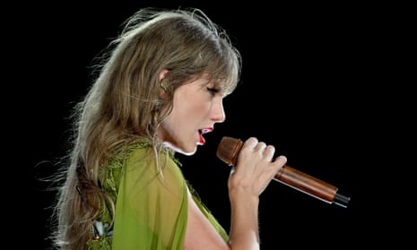 Taylor Swift performing on the Eras tour in Kansas City.
