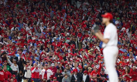 ‘Makes the Hundred look like croquet’: a cricket fan on the World Series | Cricket 5 Fans wave towels as the Phillies pitcher Aaron Nola (27) prepares to throw in game four.