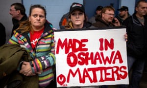General Motors workers gather for a meeting near the GM assembly plant in Oshawa, Ontario, Canada on 26 November.