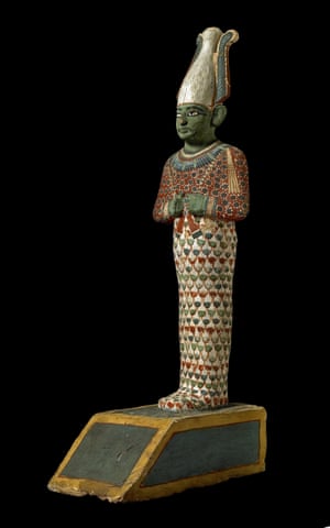 A painted wooden statuette of the God Osiris, ruler of the netherworld and judge of the dead.