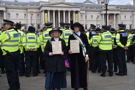 Protesters dressed as suffragettes at the protest in Trafalgar Square.
