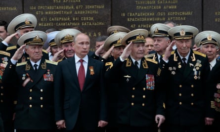 Vladimir Putin attends a parade in Sevastopol, Crimea, after its annexation by Russia in 2014
