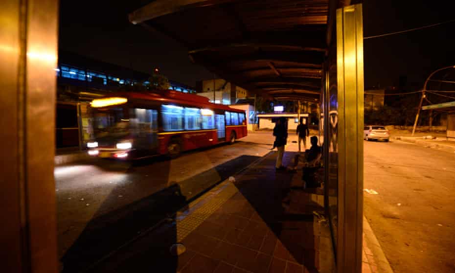 A view of a bus shelter at night in Delhi, India