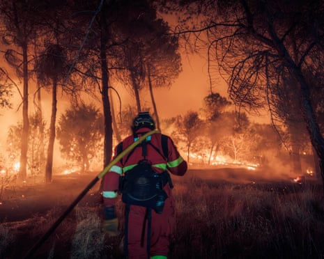 Spain’s Military Emergencies Unit (UME)personnel fighting a wildfire near Navas del Rey, 55 kilometers southwest of Madrid.