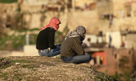 Young Palestinians<br>Two young Palestinians look out over East Jerusalem, wearing kaffiyehs to mask their faces, like many stone throwers during the Intifada, in 1988. (Photo by Peter Turnley/Corbis/VCG via Getty Images)