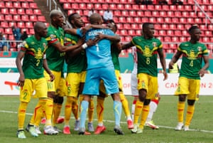 Ibrahim Mounkoro is mobbed after his fine penalty save.