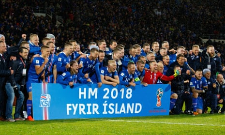 Iceland’s players and coaching staff celebrate qualifying for the 2018 World Cup in Reykjavik.