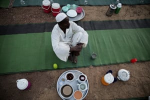 A plate is filled with chickpeas and dates ready to be provided to Muslims breaking their Ramadan fast in al-Nuba, Sudan