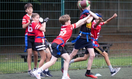 Children playing flag football at Mount Carmel school in Ealing