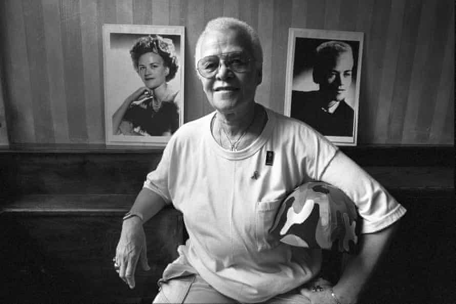 Stormé DeLarverie, one of the first and most assertive members of the gay rights movement, in front of portraits of herself in New York, June 8, 1994.