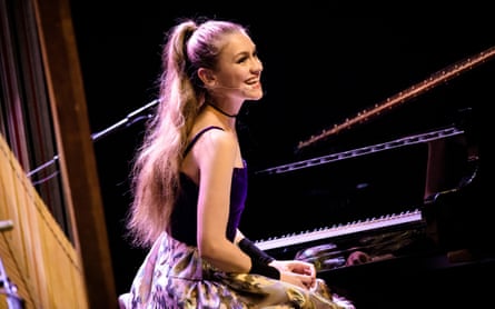 Joanna Newsom smiling, at the piano