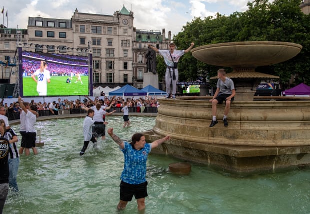 England football fans celebrate in Trafalgar Square at full time as England win Euro 2022.
