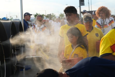 people in front of a fan
