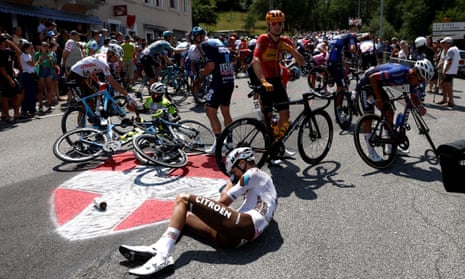 Riders try to recover from the crash on the 15th stage on Sunday.