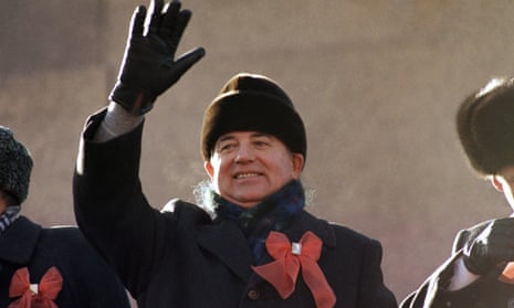 Former Soviet leader Mikhail Gorbachev waves from the parade review stand of the Lenin Mausoleum on 7 November, 1987 in Moscow' s Red Square.
