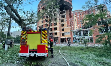 Firefighters begin searching a shopping mall, office and apartment buildings damaged by a Russian missile strike.