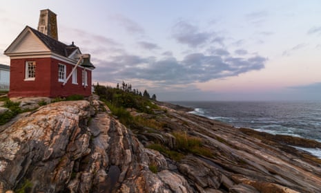 Pemaquid Point Lighthouse in Bristol, Maine, at sunset on a summer evening.