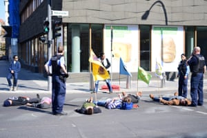 Protesters lay down in road