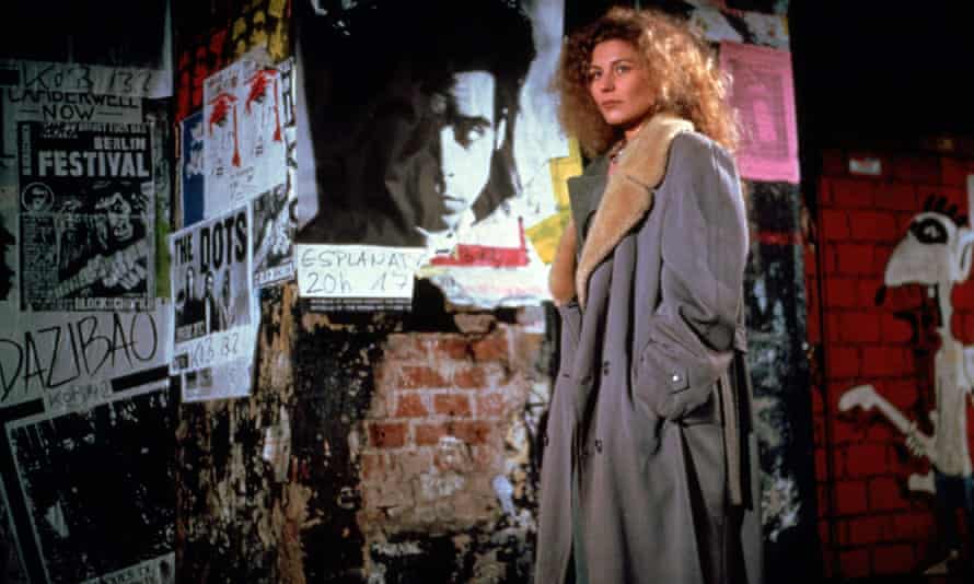 Solveig Dommartin standing by a Nick Cave poster in Wings of Desire (1987).