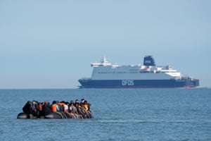 Large DFDS ferry in background with small vessel full on people in foreground