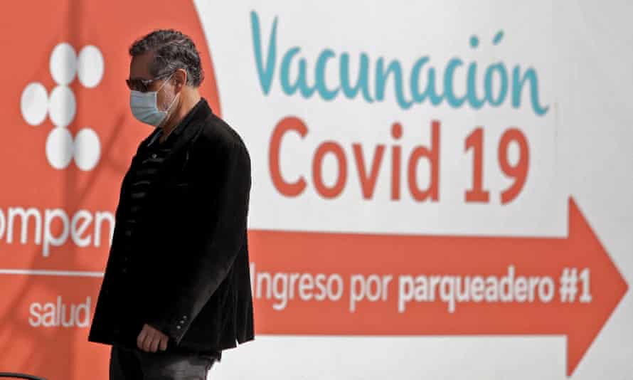 A man walks past a Covid-19 vaccination station in Bogota, Colombia.