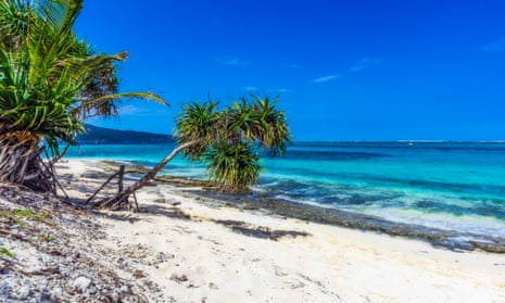 Beautiful South Pacific Island with clear blue ocean and sandy beach