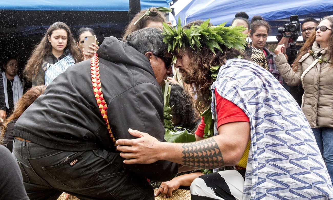 The actor Jason Momoa exchanges a traditional greeting with an elder while visiting protesters last month.