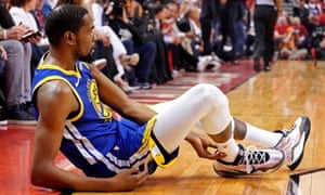 Kevin Durant goes to the floor with a leg injury