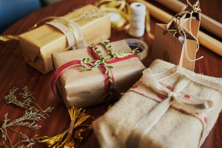 A variety of Christmas presents wrapped andsitting on a table during the holidays.