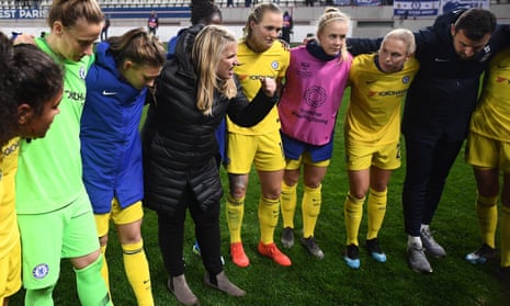 Chelsea’s head coach Emma Hayes celebrates with her players after they knocked Paris Saint-Germain out of the Champions League