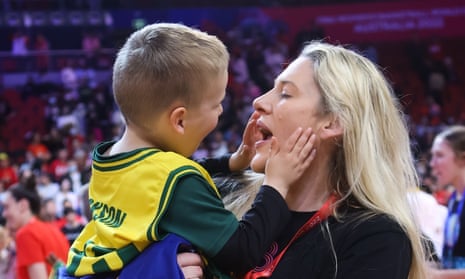 Lauren Jackson with her son after playing her final game for Australia on Saturday, when she helped the Opals to win World Cup bronze in Sydney.