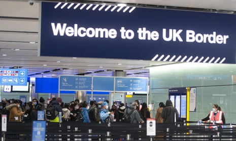Passengers line up for passport control in the UK Border area of Terminal 2 of Heathrow Airport,