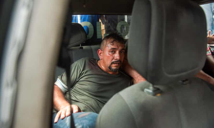 One of two foreign men in custody for allegedly participating in the assassination plot against President Jovenel MoĂ¯se sits in the back of a police vehicle in Port-au-Prince on Thursday.