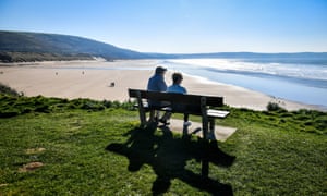 People enjoying the sunshine at Woolacombe, North Devon, as Britain experienced warm February temperatures.