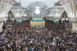 lots of people in a huge room with pillars