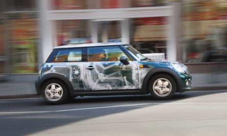 A Mini car with graphics on the door to give the impression of X ray of the driver sitting in their seat