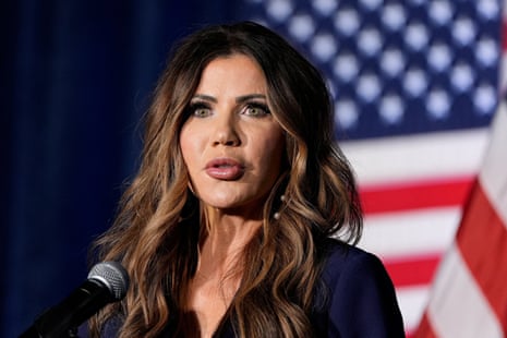 A woman in front of a US flag
