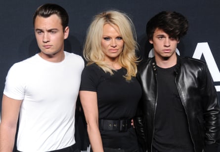 Brandon Lee, Pamela Anderson and Dylan Lee attend the Saint Laurent show at The Hollywood Palladium on February 10, 2016 in Los Angeles, California.